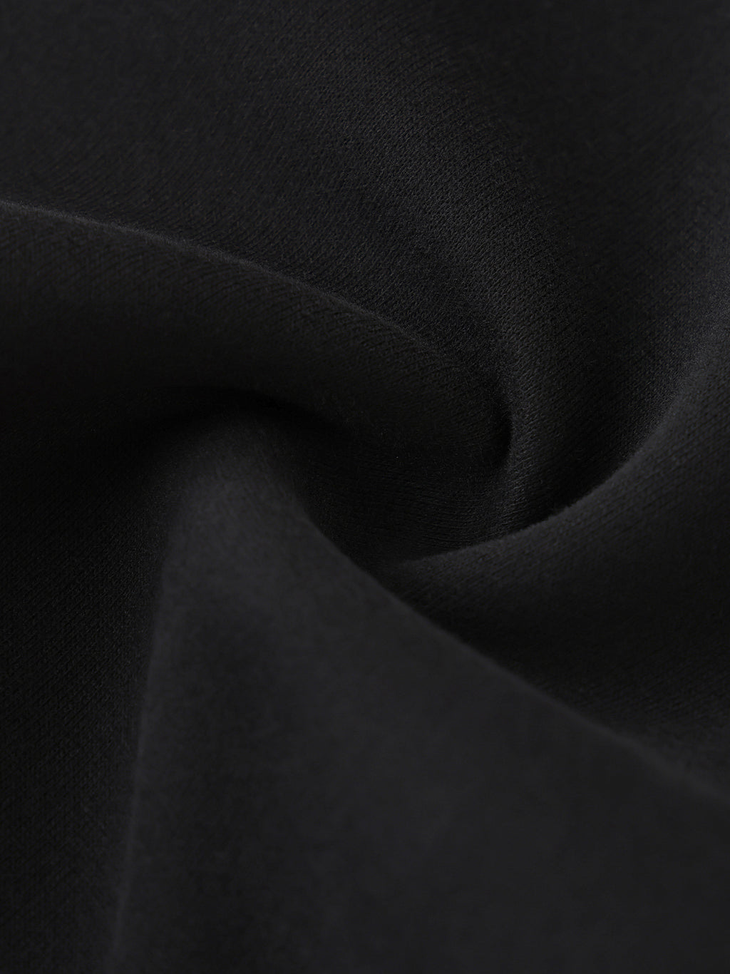 Close-up of dark gray fabric with folds